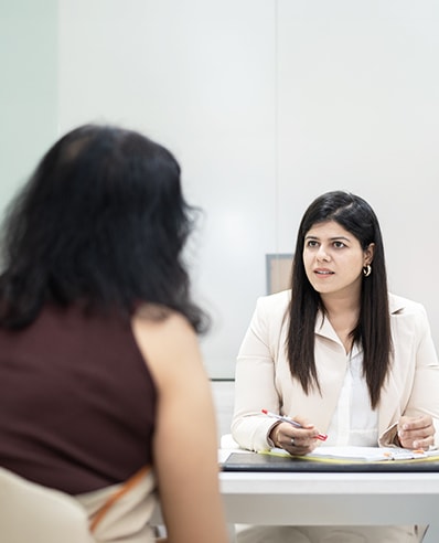 Dentist consulting with a patient at The Dentique